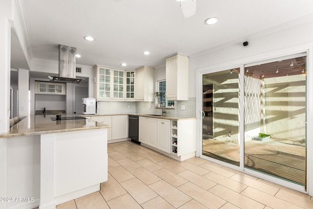 kitchen featuring white cabinetry, light stone countertops, kitchen peninsula, island exhaust hood, and decorative backsplash