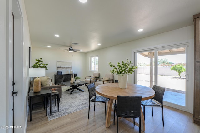 dining space featuring recessed lighting, light wood-style floors, ceiling fan, and visible vents