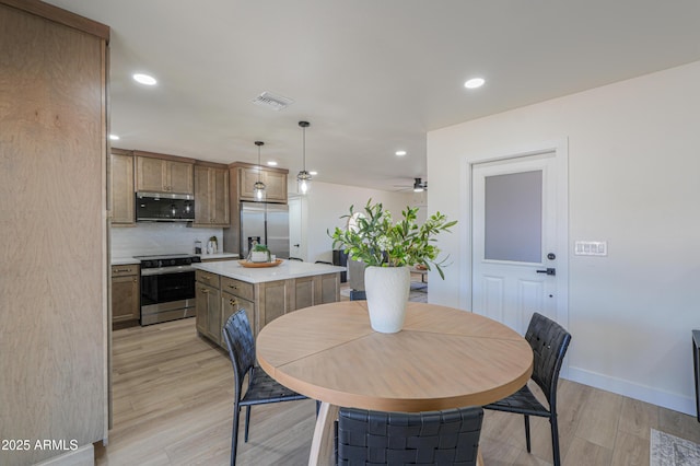 dining area with a ceiling fan, baseboards, recessed lighting, light wood-type flooring, and visible vents