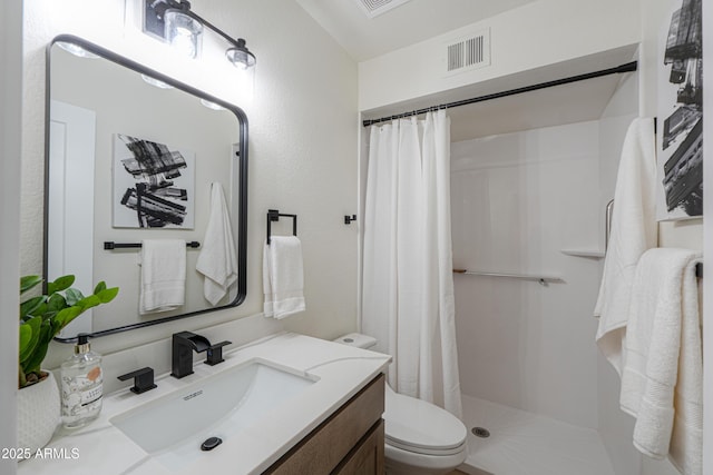 bathroom with visible vents, curtained shower, toilet, and vanity