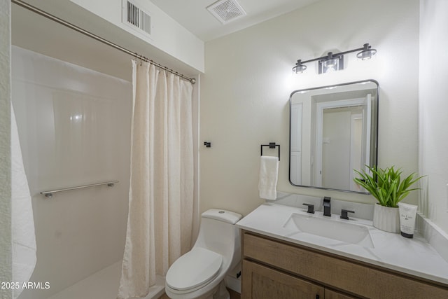 bathroom featuring vanity, a shower with shower curtain, toilet, and visible vents