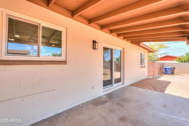 view of patio / terrace featuring fence