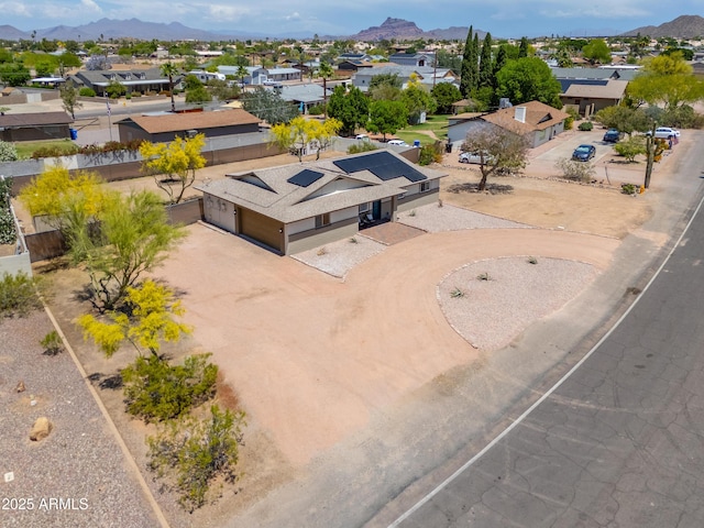 drone / aerial view featuring a mountain view and a residential view