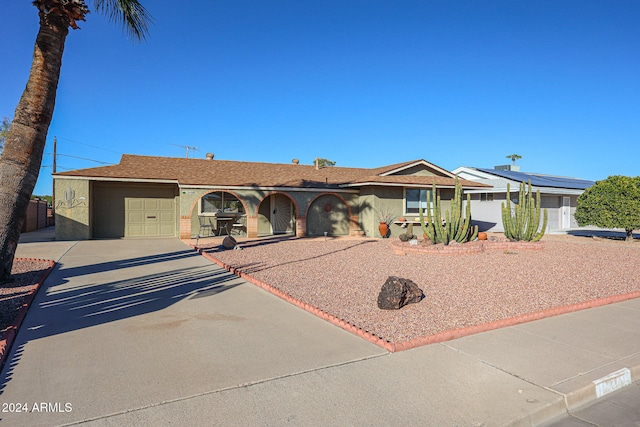 ranch-style house featuring a garage