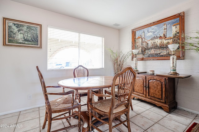 dining space with light tile patterned flooring