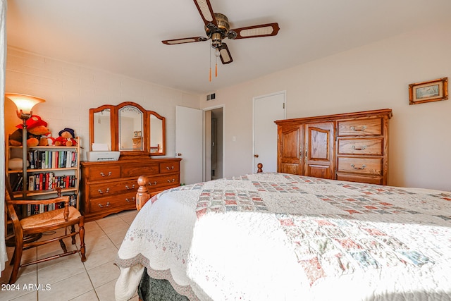 bedroom with ceiling fan and light tile patterned floors