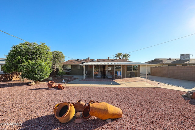 back of property with a patio area