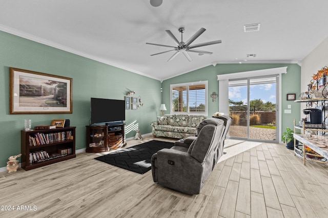 living room with light hardwood / wood-style flooring, crown molding, and vaulted ceiling