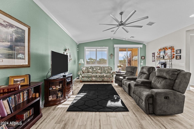 living room with ceiling fan, light hardwood / wood-style flooring, crown molding, and lofted ceiling