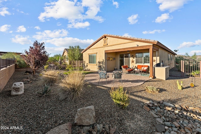 back of house with a patio