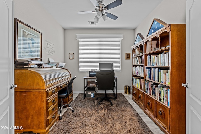 office with ceiling fan and plenty of natural light