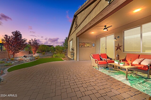 patio terrace at dusk with an outdoor hangout area