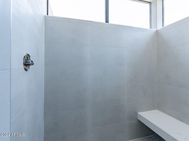 bathroom with tiled shower