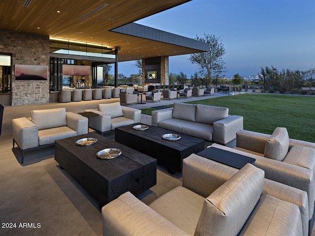 exterior space with an outdoor living space with a fireplace