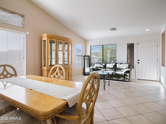 dining space with vaulted ceiling, light tile patterned floors, recessed lighting, and visible vents