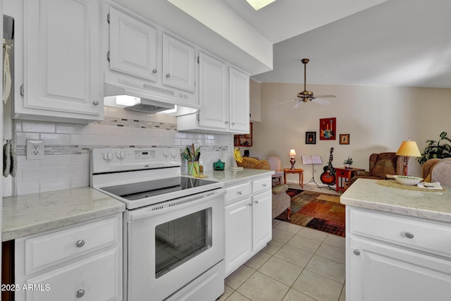 kitchen with white electric range, decorative backsplash, white cabinets, and light tile patterned flooring