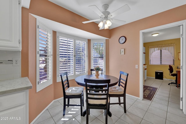 dining room featuring light tile patterned floors and ceiling fan