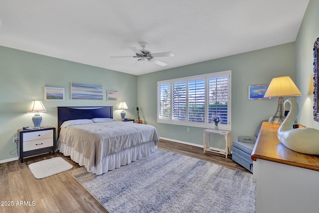 bedroom with hardwood / wood-style flooring and ceiling fan