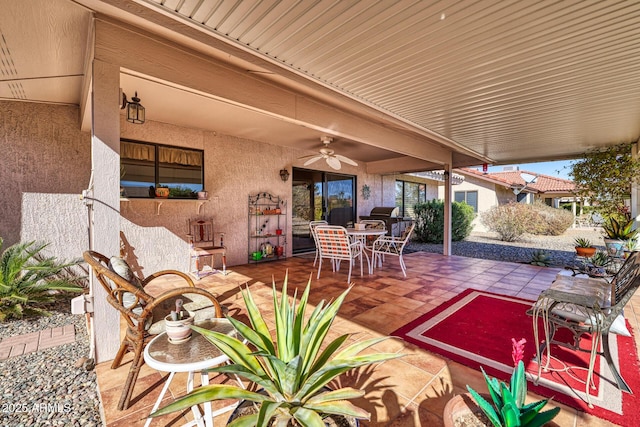 view of patio / terrace with ceiling fan and area for grilling