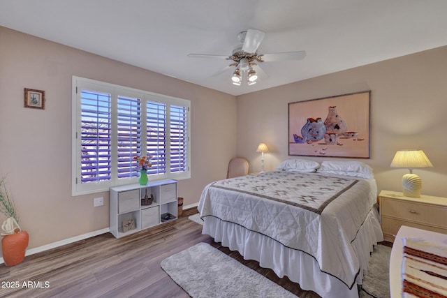 bedroom featuring hardwood / wood-style floors and ceiling fan