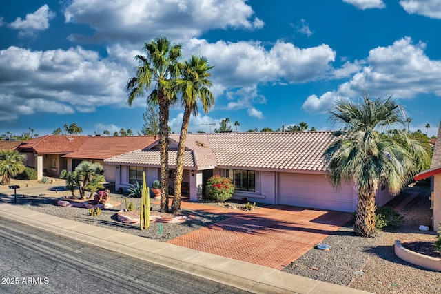 ranch-style home featuring a garage