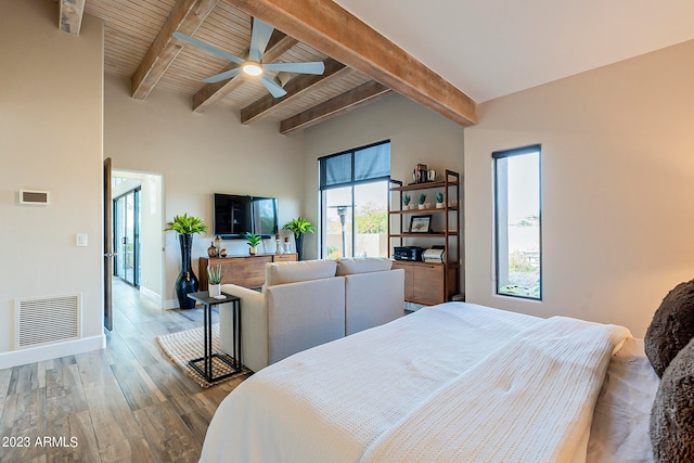 bedroom featuring wooden ceiling, beamed ceiling, wood-type flooring, and ceiling fan