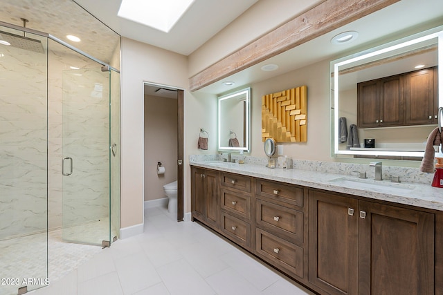 bathroom featuring vanity, toilet, tile patterned floors, and an enclosed shower