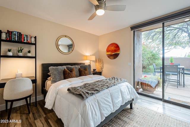 bedroom featuring ceiling fan, dark hardwood / wood-style flooring, and access to exterior