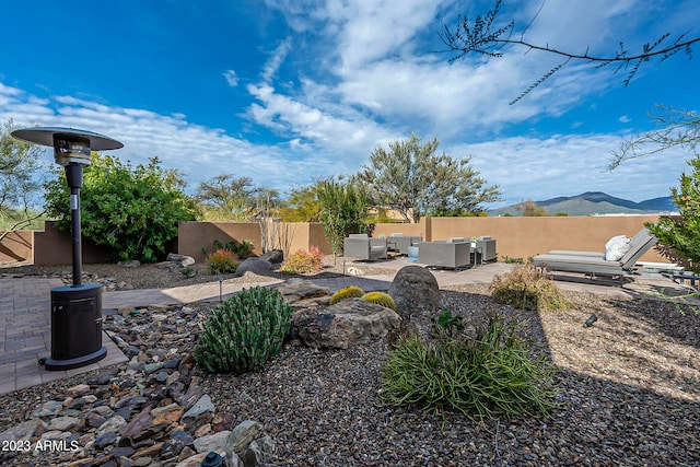 view of yard with a mountain view and a patio