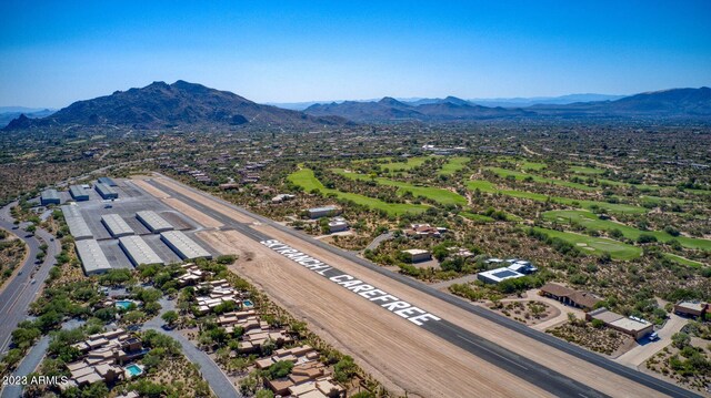 birds eye view of property with a mountain view