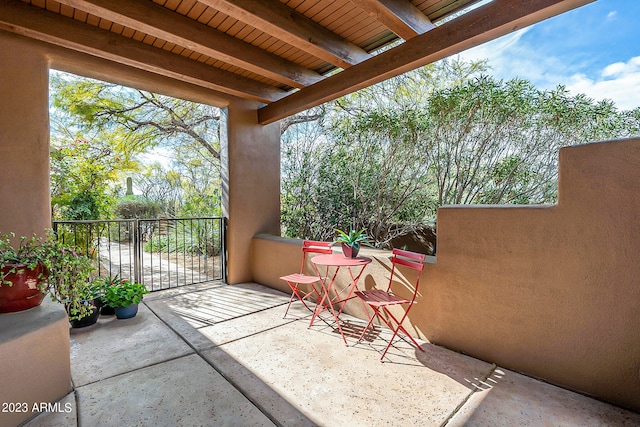 view of patio featuring a balcony