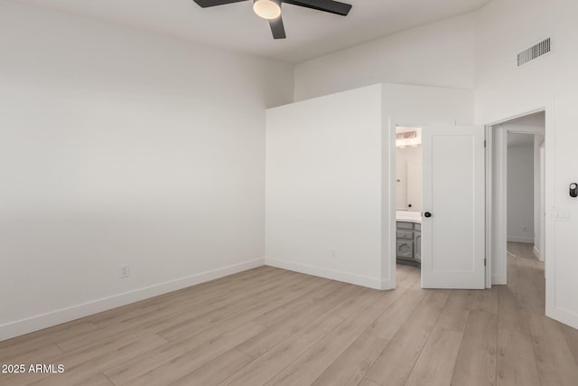 unfurnished room with light wood-type flooring and ceiling fan