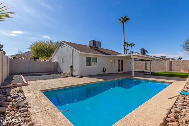 view of pool featuring a patio area and central air condition unit