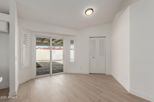 unfurnished room featuring light hardwood / wood-style floors