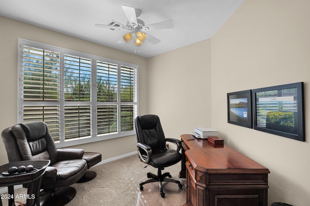 carpeted office with ceiling fan