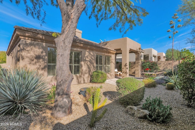 rear view of property featuring a patio area