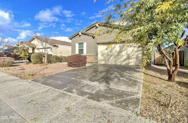 single story home featuring a garage, a tiled roof, concrete driveway, and stucco siding