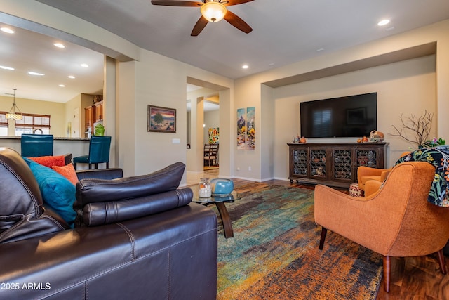 living room with ceiling fan and hardwood / wood-style floors