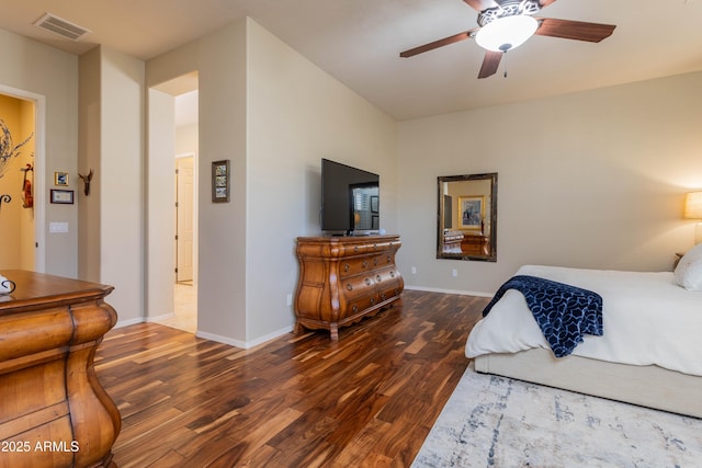 bedroom with ceiling fan and dark wood-type flooring