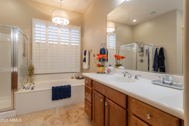 bathroom featuring plus walk in shower, vanity, and a notable chandelier