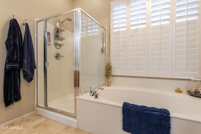 bathroom featuring separate shower and tub and tile patterned floors