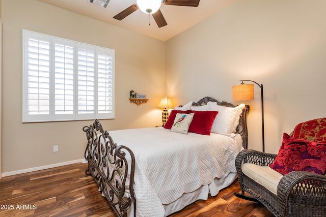 bedroom featuring ceiling fan and dark wood-type flooring