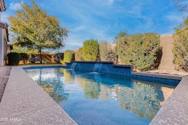 view of swimming pool featuring pool water feature