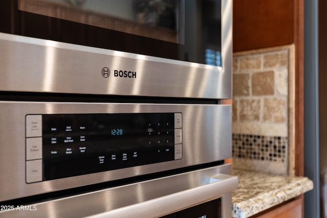 room details with light stone counters and double oven