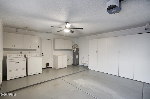garage with washing machine and clothes dryer, visible vents, a garage door opener, a ceiling fan, and electric water heater