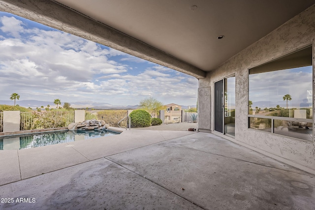 view of patio featuring a fenced in pool and fence