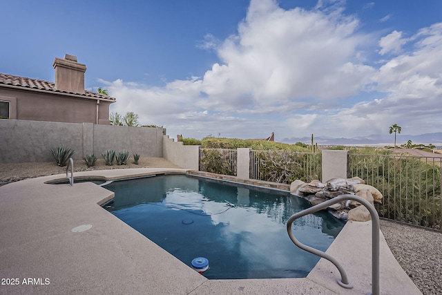 view of pool with fence and a fenced in pool