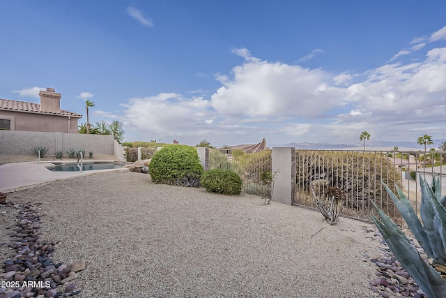 view of yard featuring a patio area, a fenced in pool, and fence private yard