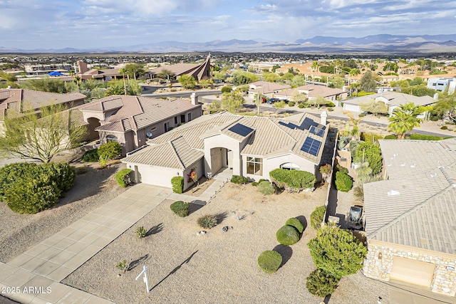 birds eye view of property featuring a mountain view and a residential view