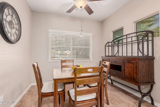 dining room featuring ceiling fan